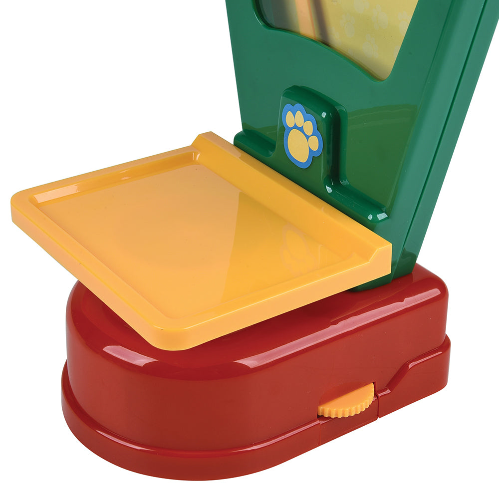 Toy pet scale with green top, yellow middle section, and red base on a white background