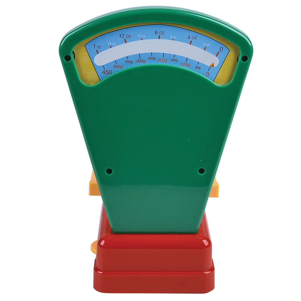 Colorful toy scale with a green display and red base on a white background