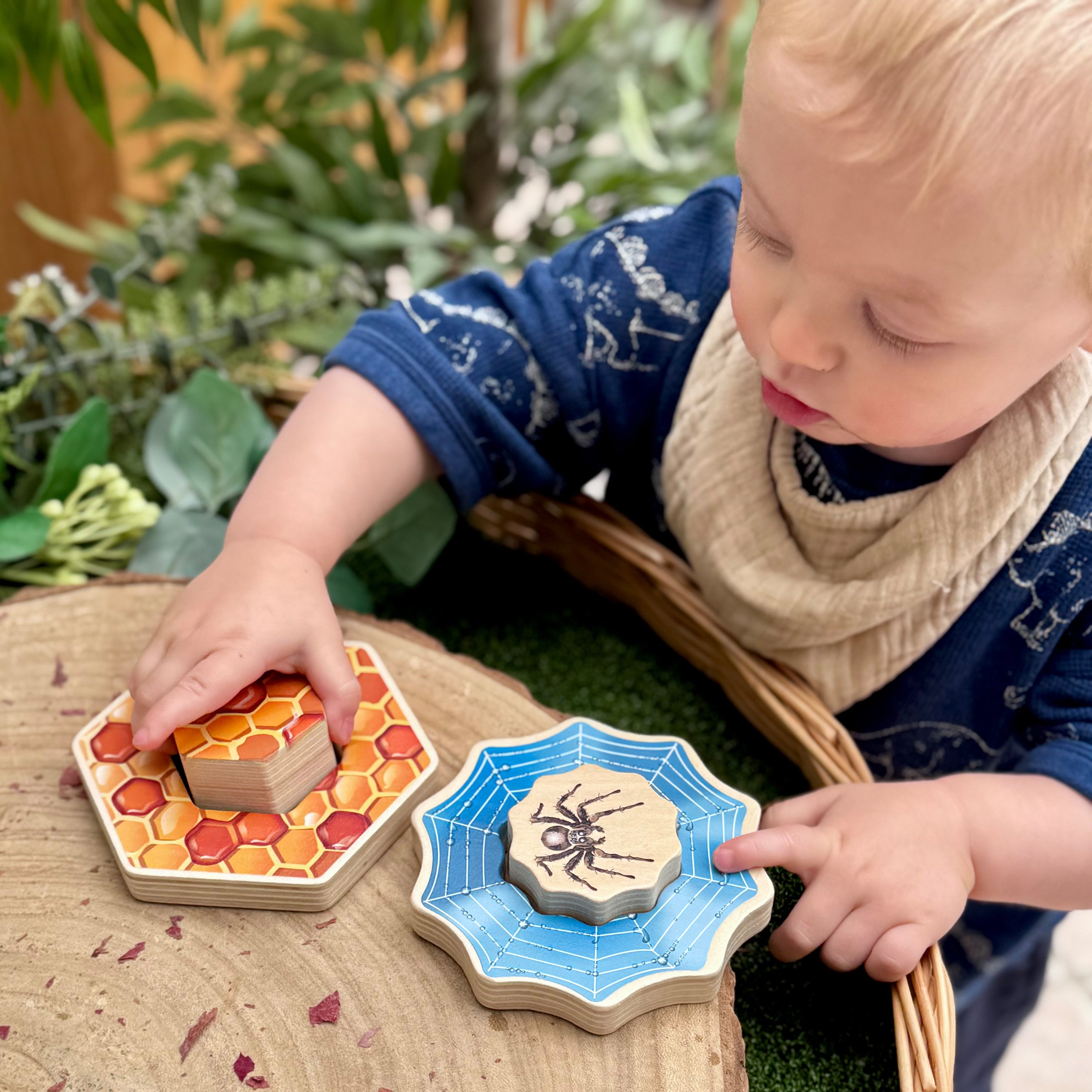 Child playing with educational wooden toys outdoors