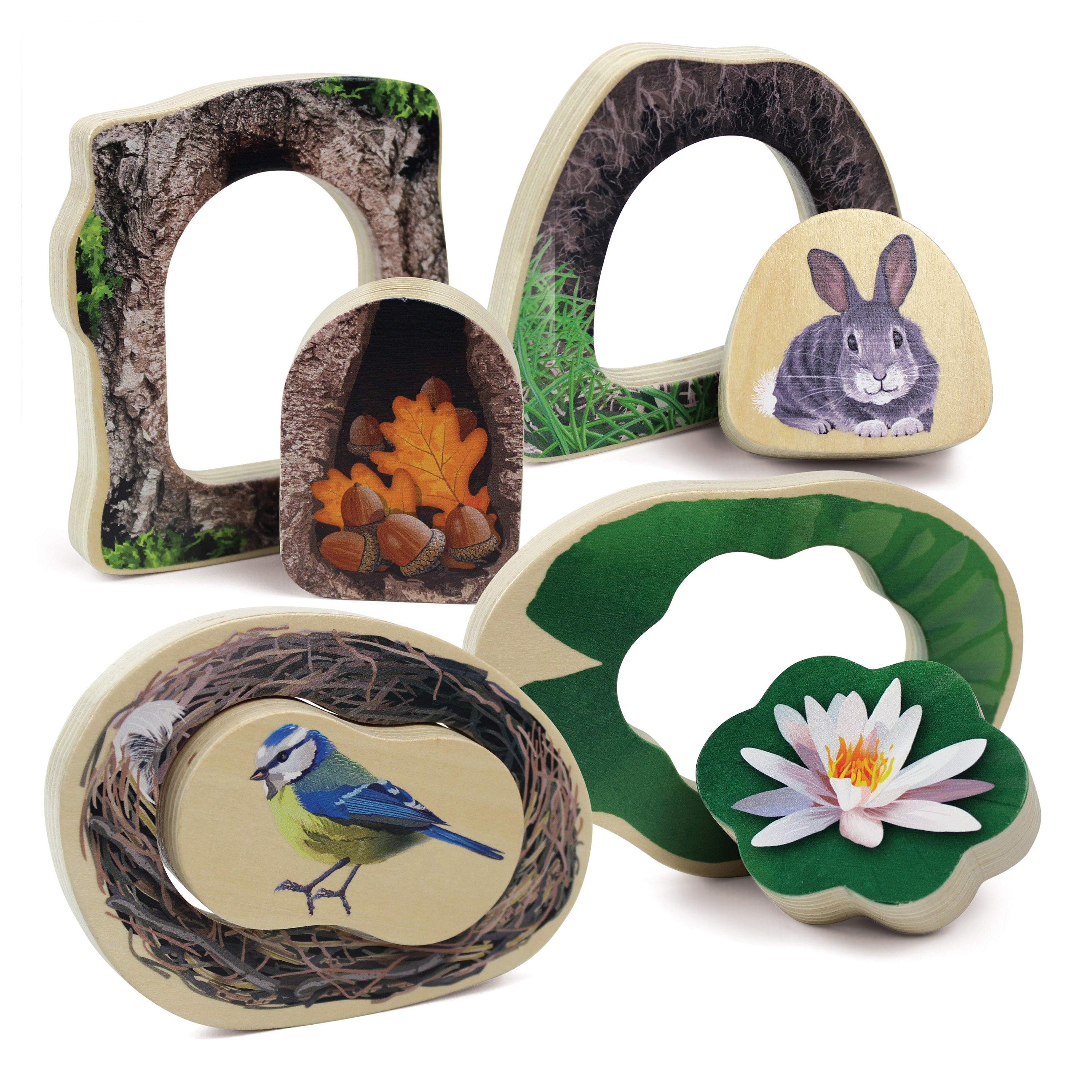 Set of wooden animal-shaped toys with nature-themed designs on a white background