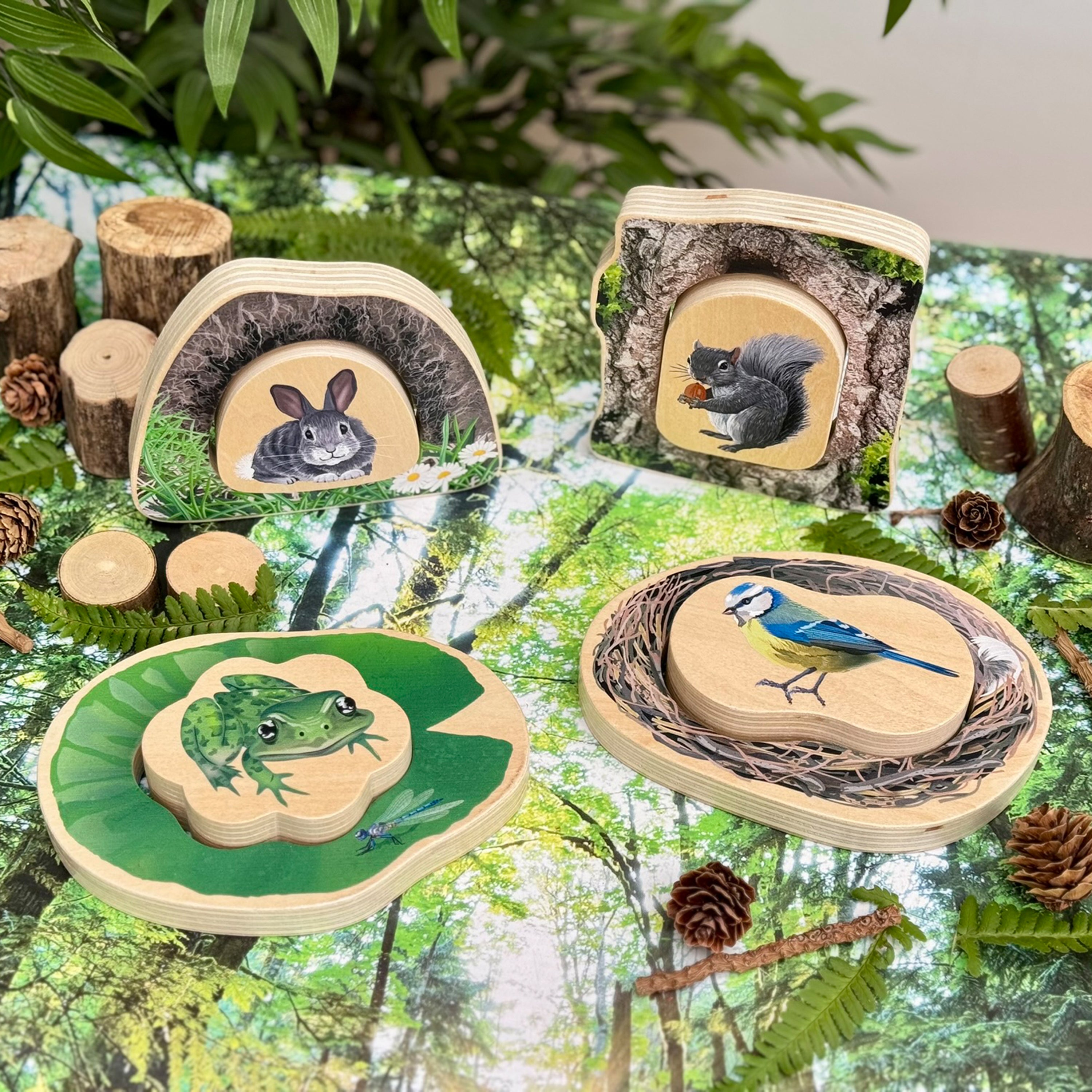 Set of wooden puzzles with animal illustrations on a forest-themed background