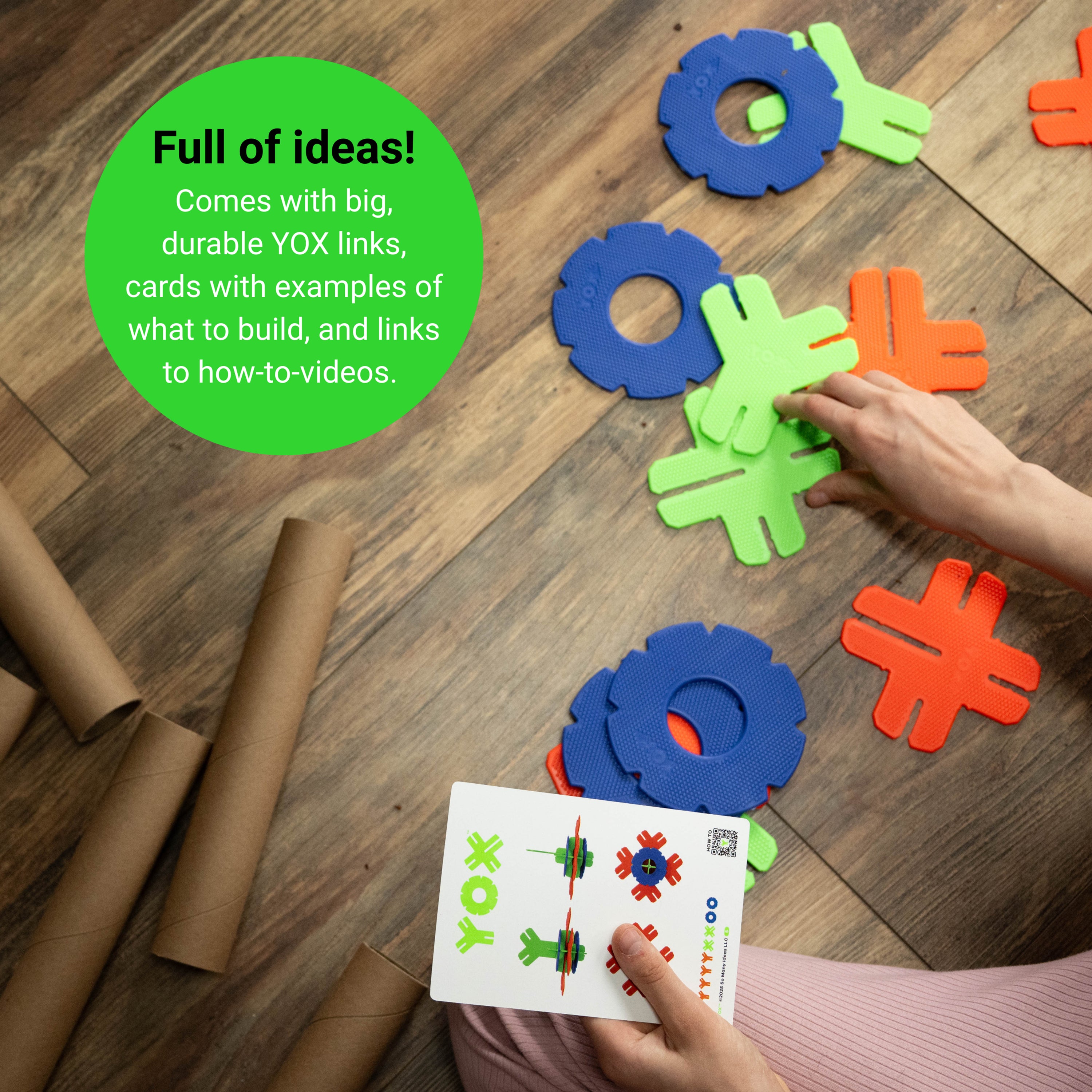 Colorful foam links and cards on a wooden floor with text about ideas and resources.